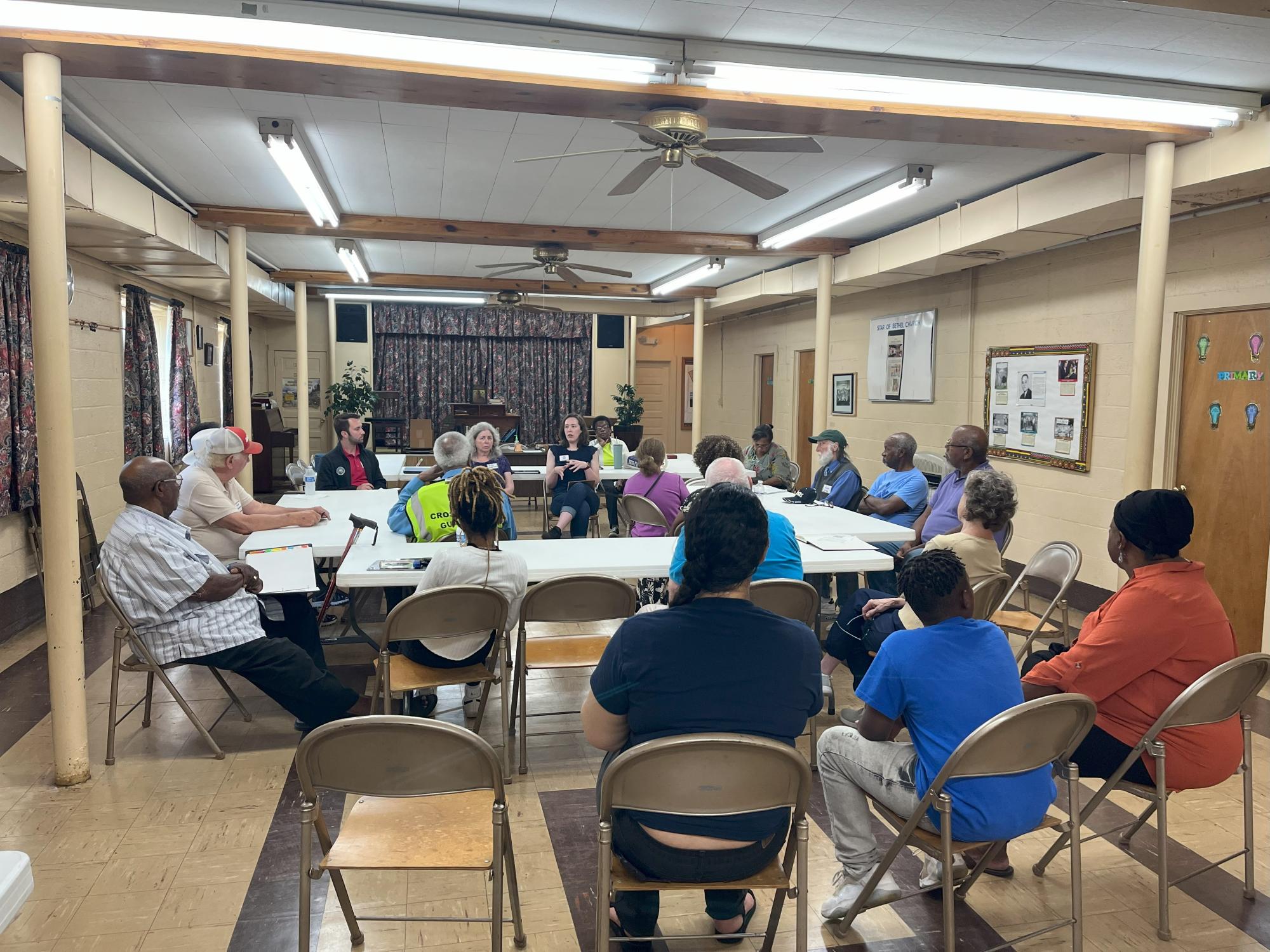 Group of people meeting for the first public information session of the Neighborhood History Project. Location was star of bethel church basement.